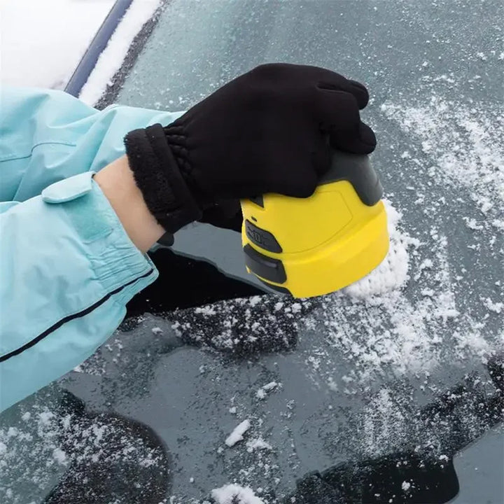Electric ice scraper on frosty windscreen