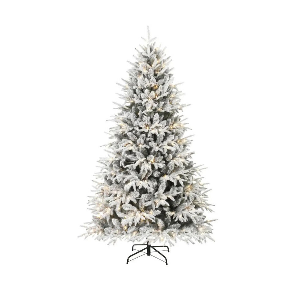 Full snow-flocked tree with warm LEDs