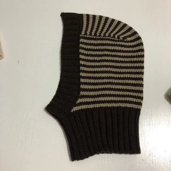 Person wearing striped knitted balaclava hood