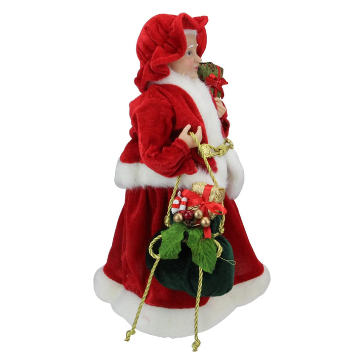 Mrs Claus figure carrying presents