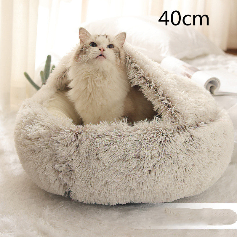 Cat curled in round plush hooded pet bed