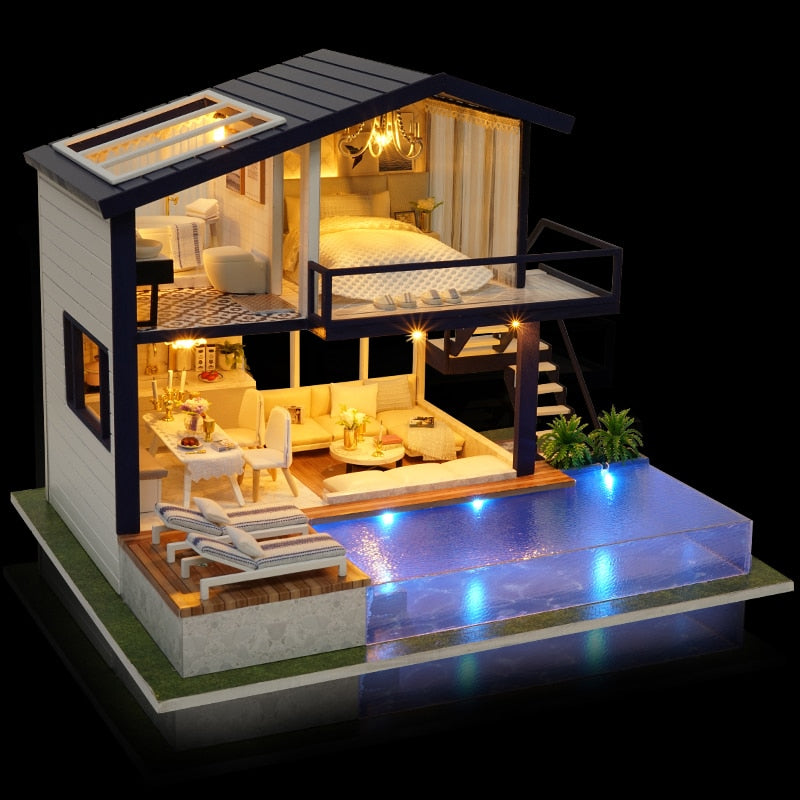 Finished miniature dollhouse with lights on