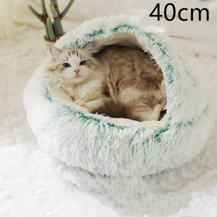 Cat curled in round plush hooded pet bed
