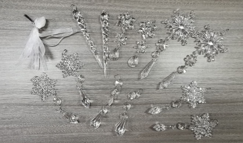 Clear acrylic icicle ornaments hanging on Christmas tree
