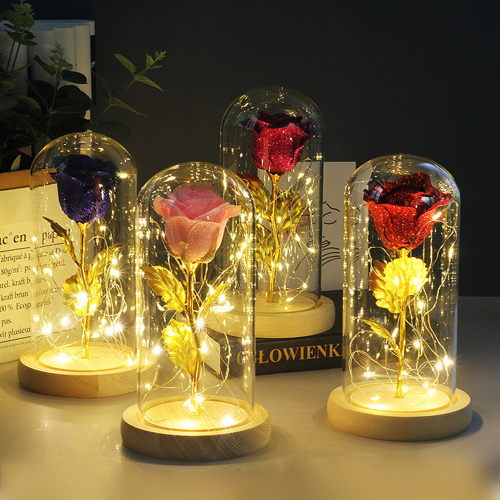 Preserved red rose in lit glass dome