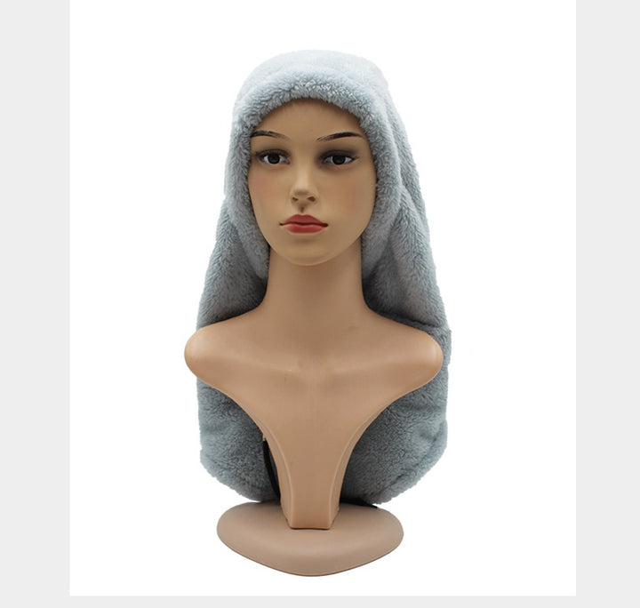 Woman wearing beige plush hood with scarf