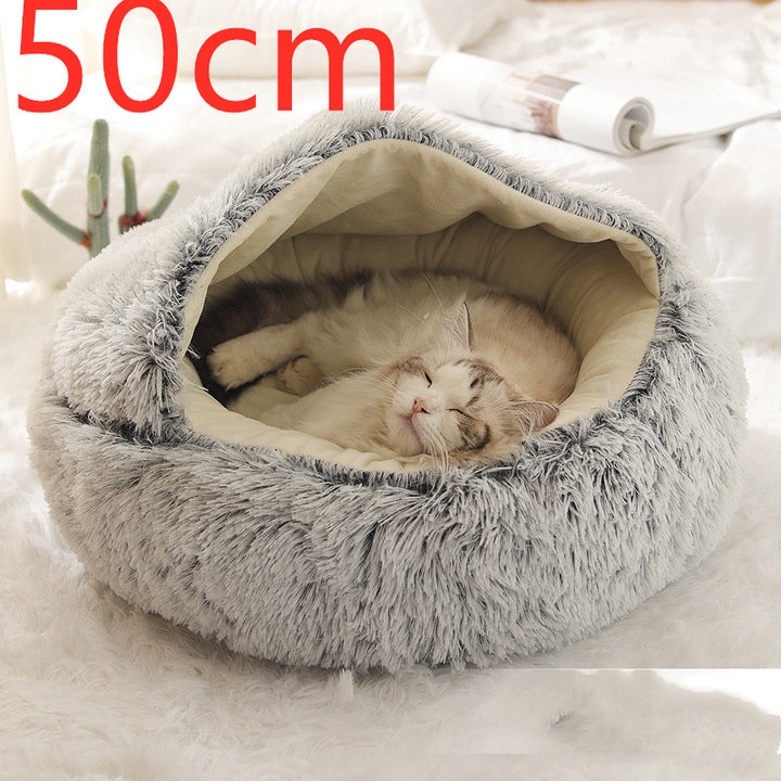 Cat curled in round plush hooded pet bed
