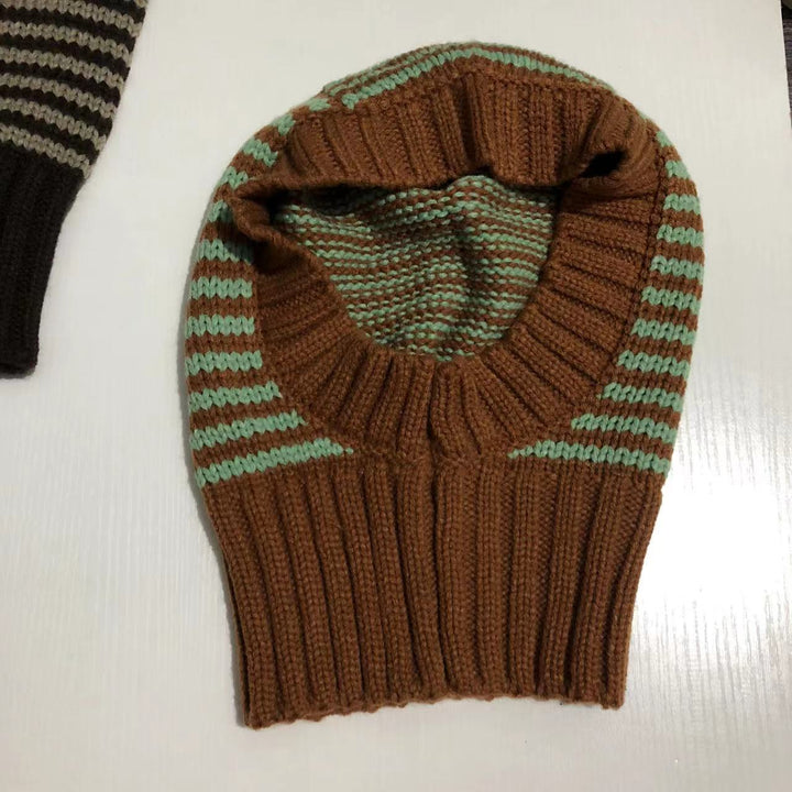 Person wearing striped knitted balaclava hood