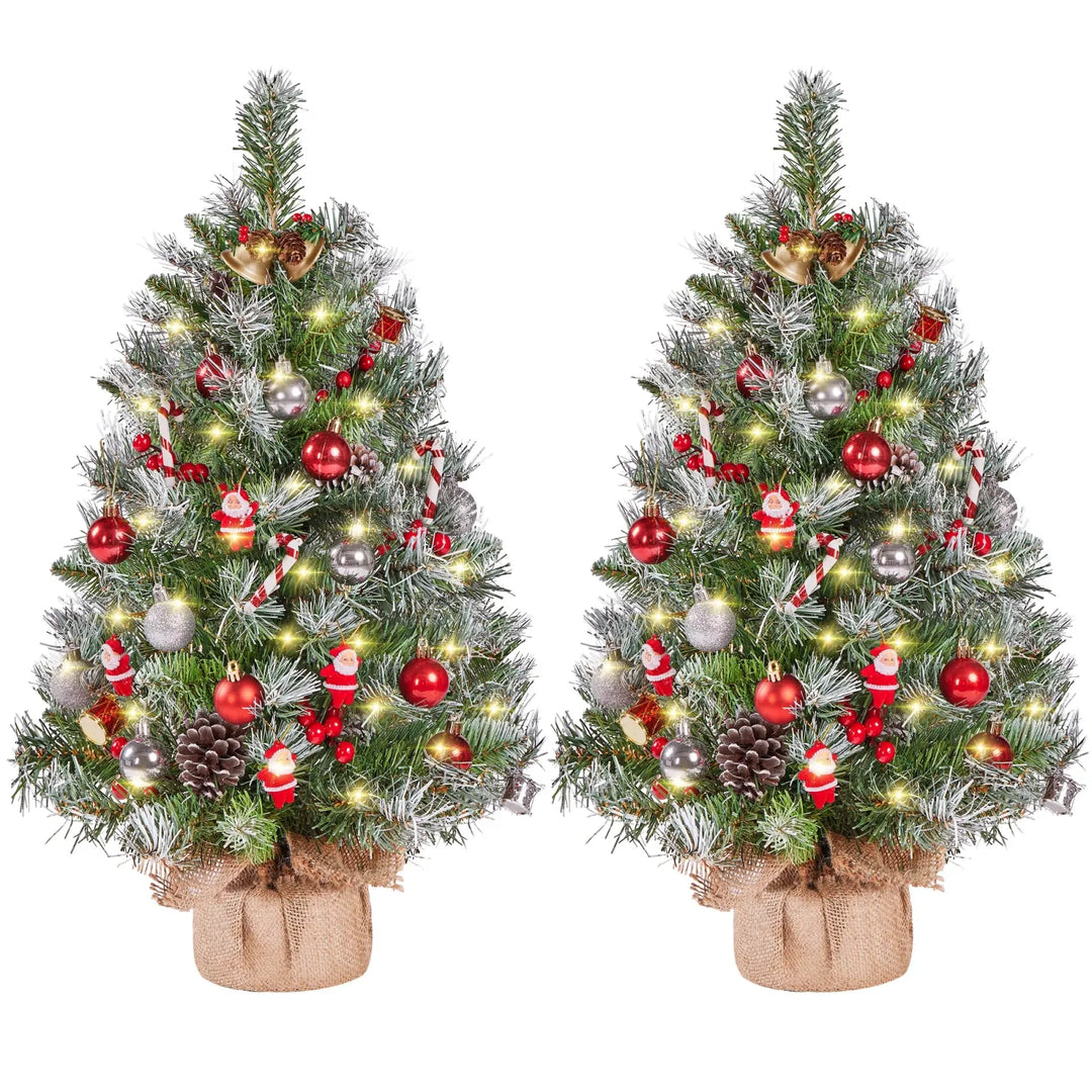 Two frosted tabletop trees with burlap bases