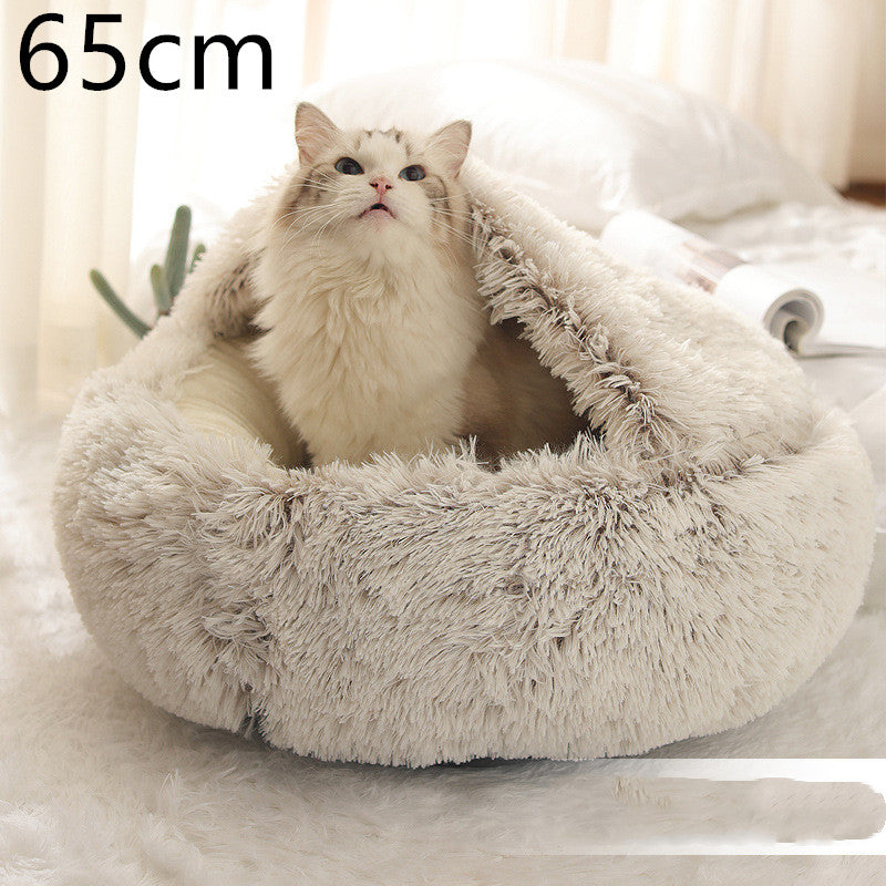 Cat curled in round plush hooded pet bed