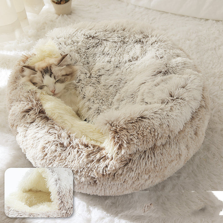 Cat curled in round plush hooded pet bed