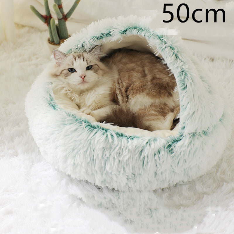 Cat curled in round plush hooded pet bed