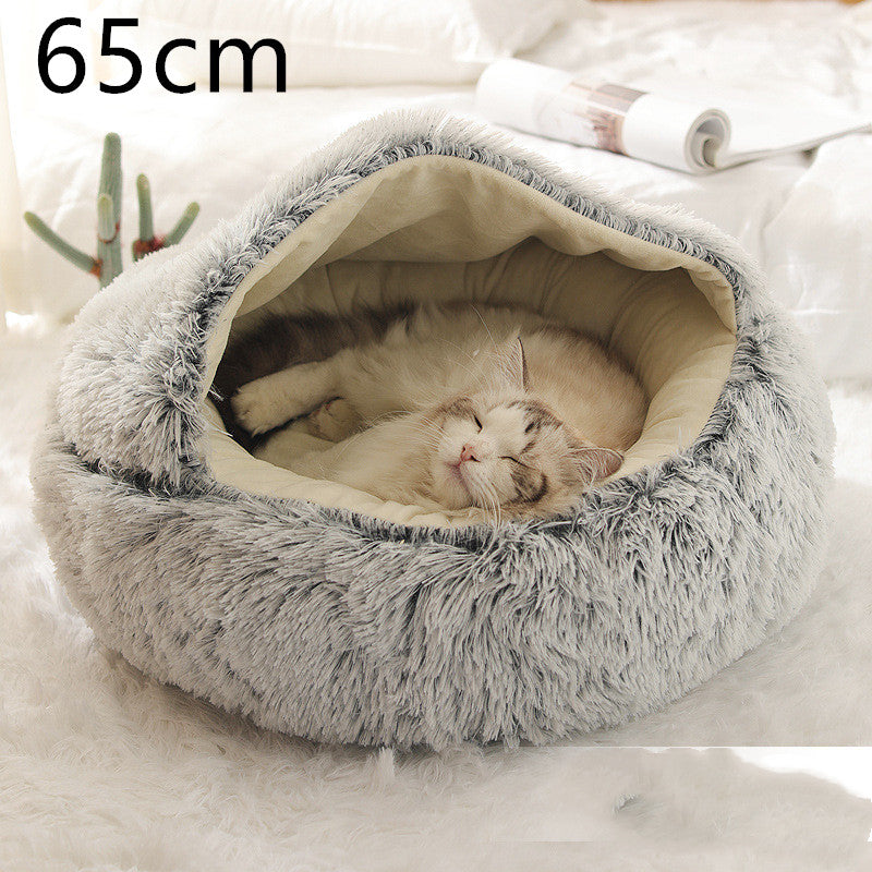 Cat curled in round plush hooded pet bed