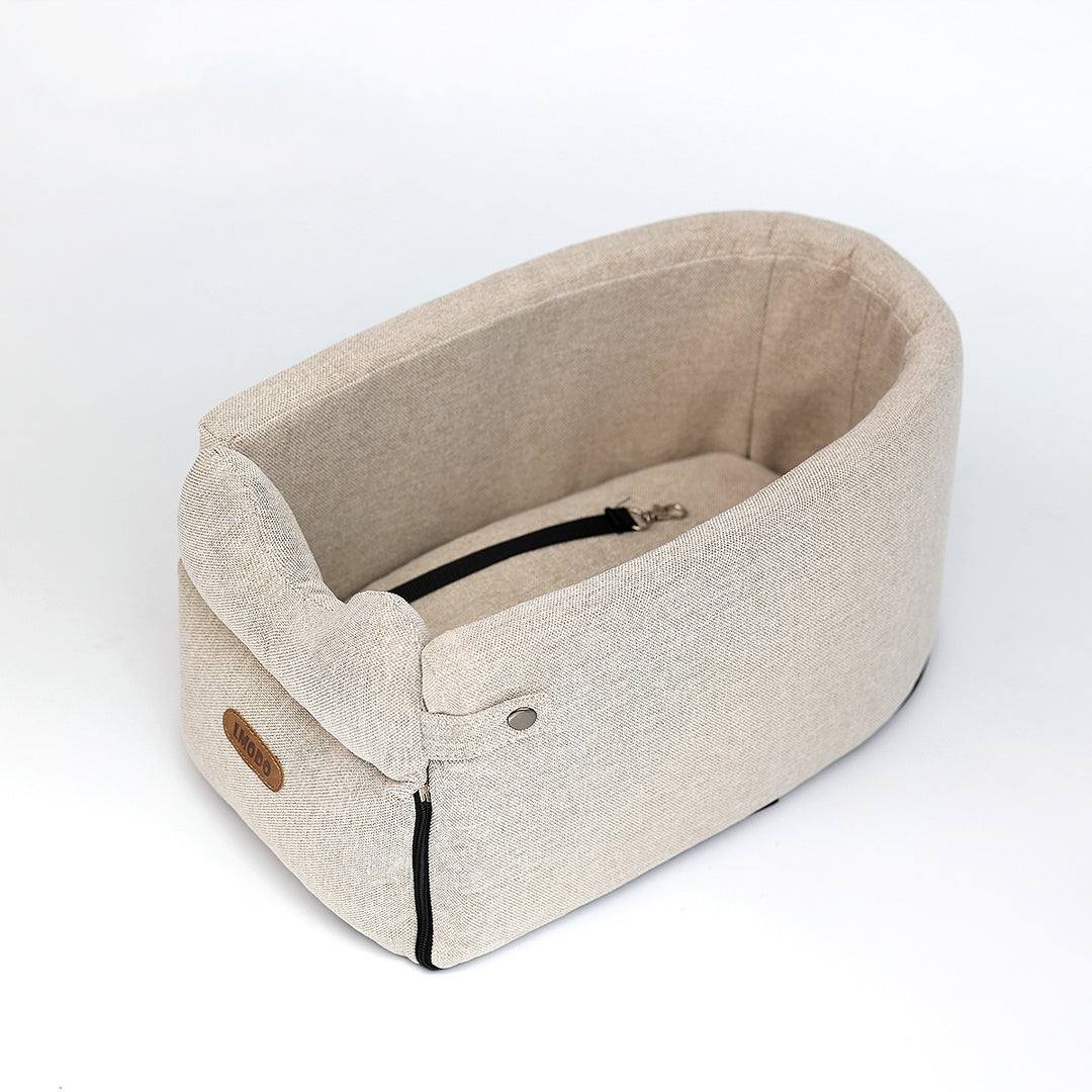 Small dog in armrest car seat