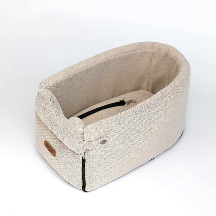 Small dog in armrest car seat