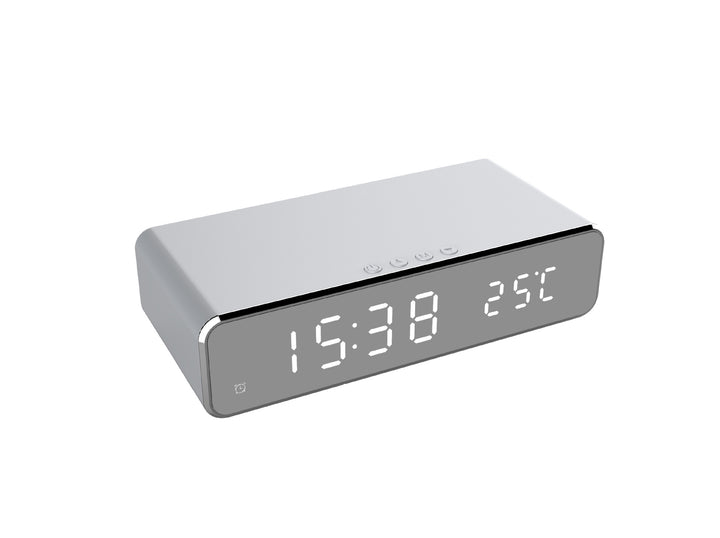 Mirror LED alarm clock charging a phone