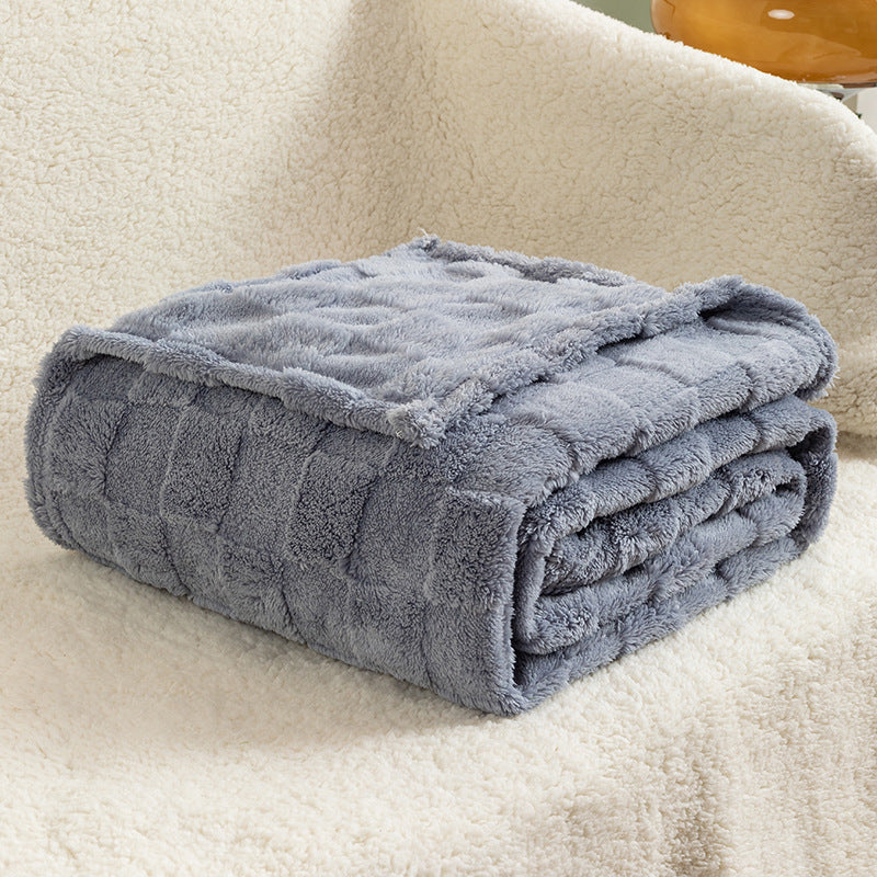 Cream checked plush throw blanket on sofa