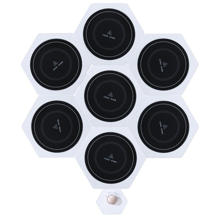 White hexagonal warming plates with dishes on top