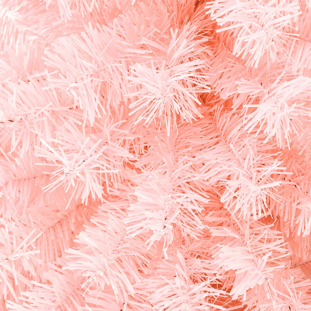 Pink artificial Christmas tree in living room