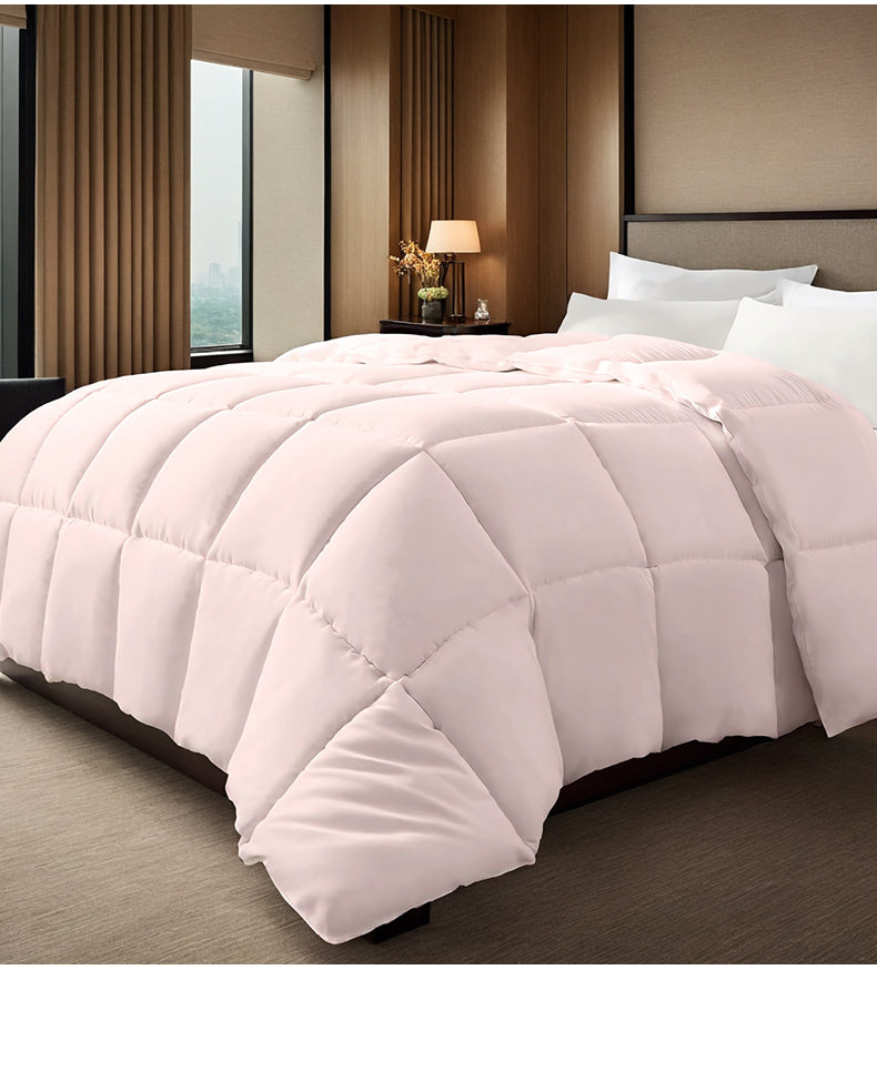 Pink box-stitched duvet on bed