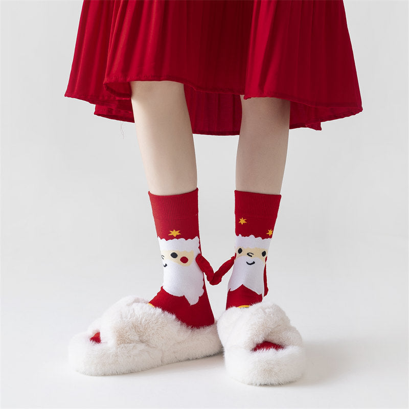Christmas socks with magnetic hands linked
