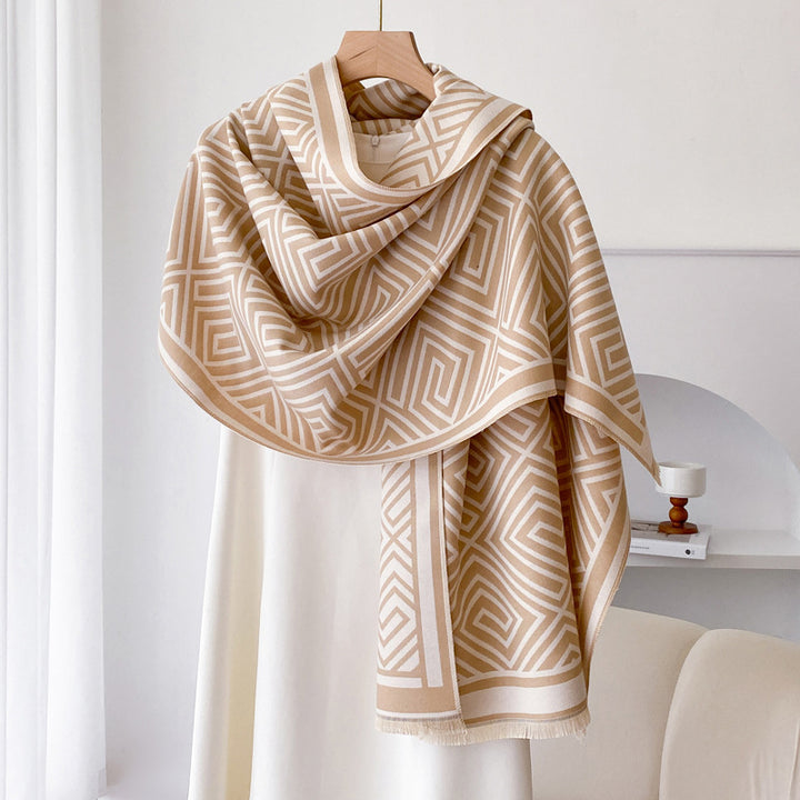 Woman wearing grey fringed shawl cape