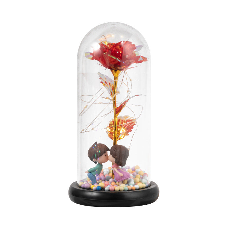Red rose in glass dome with lights