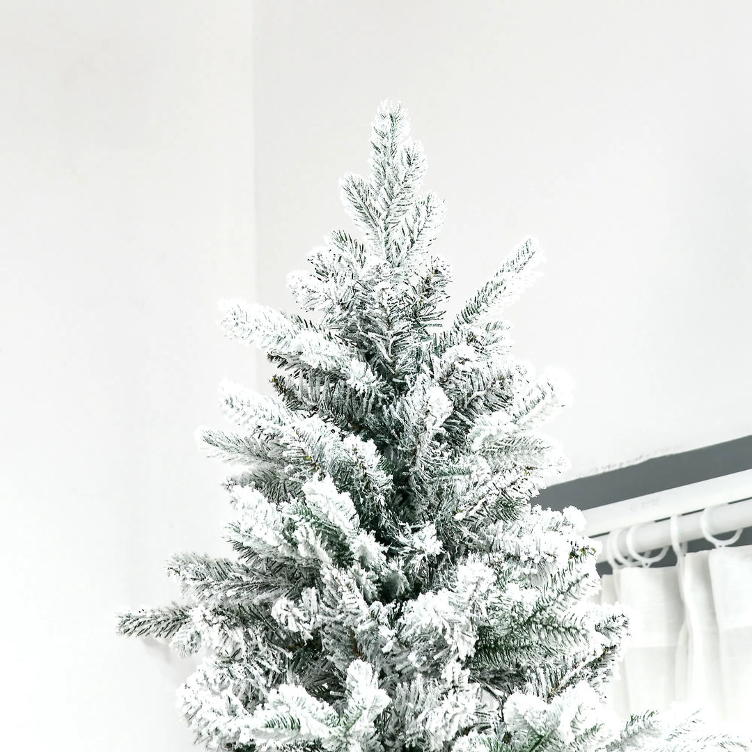 Tall snow-flocked deodar pine tree