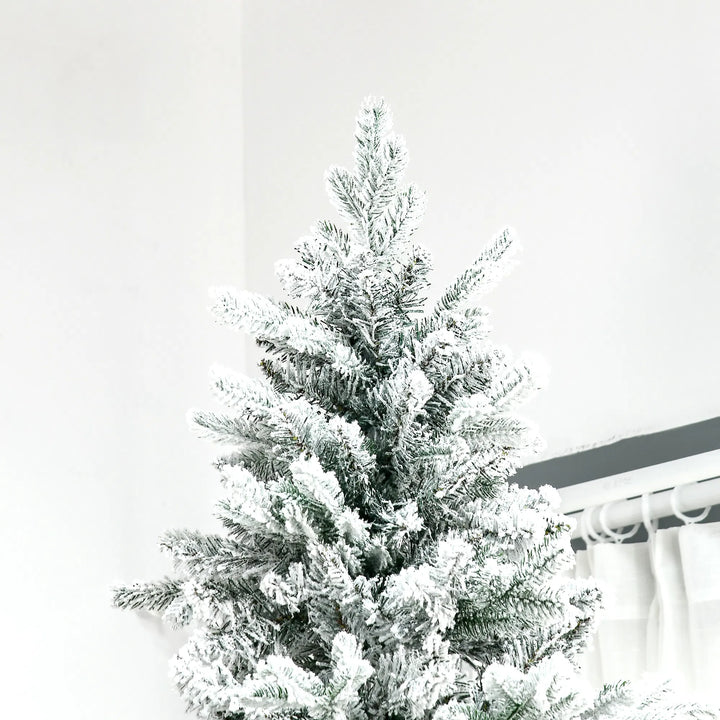 Tall snow-flocked deodar pine tree