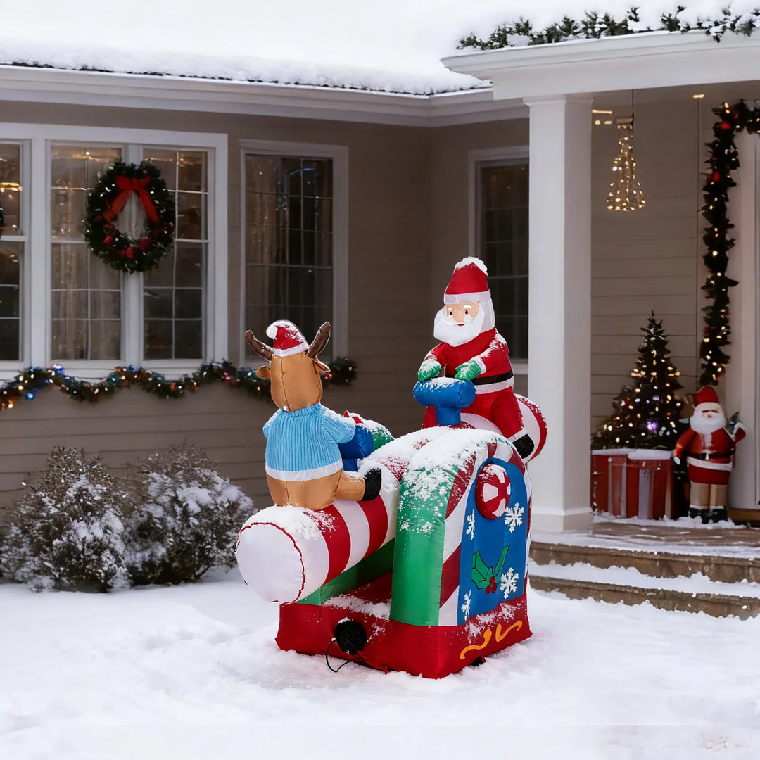 Inflatable Santa and reindeer on seesaw