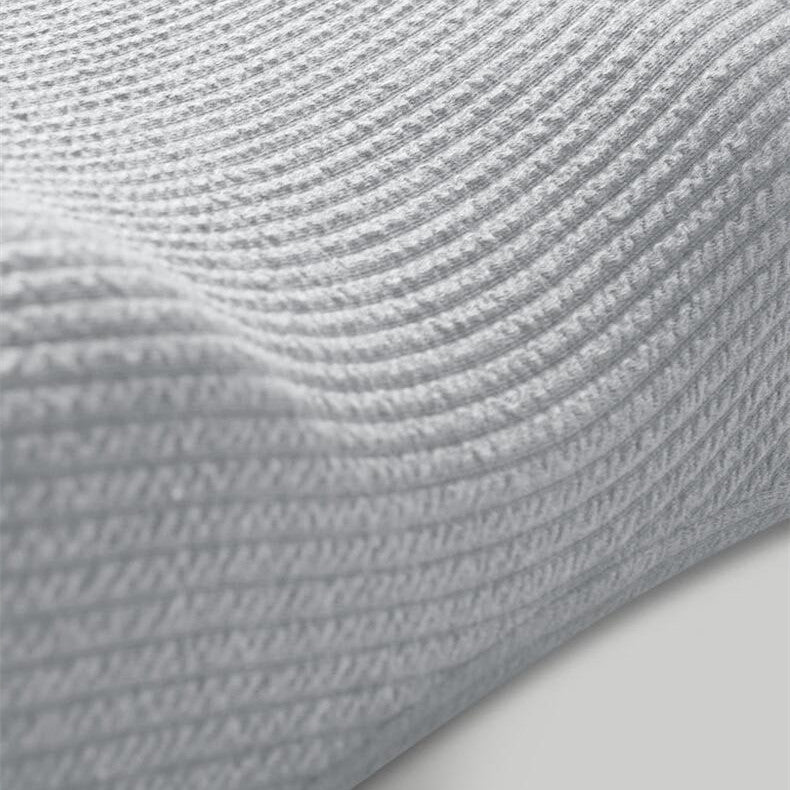 Grey memory foam pillow with knitted cover