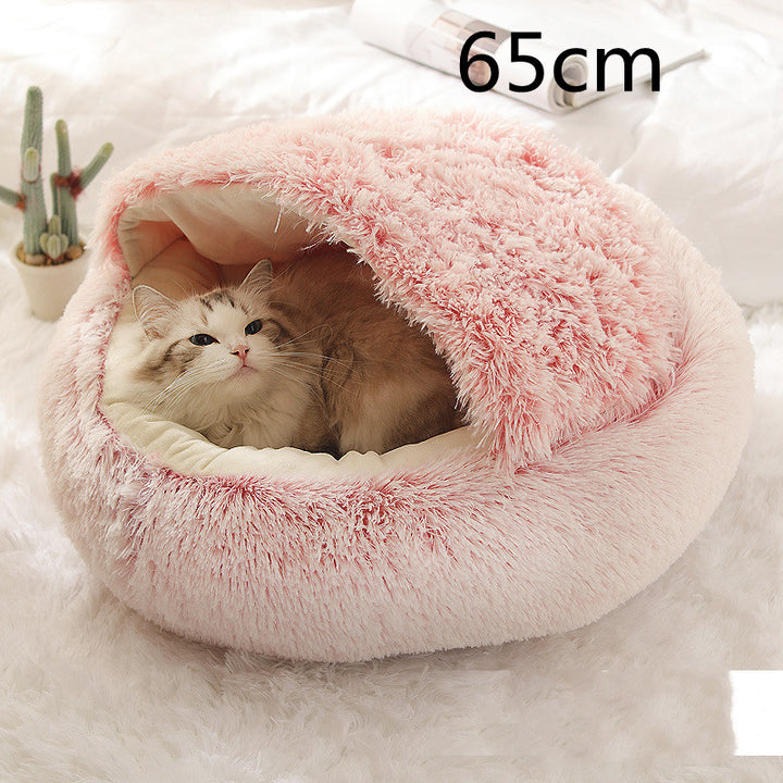 Cat curled in round plush hooded pet bed