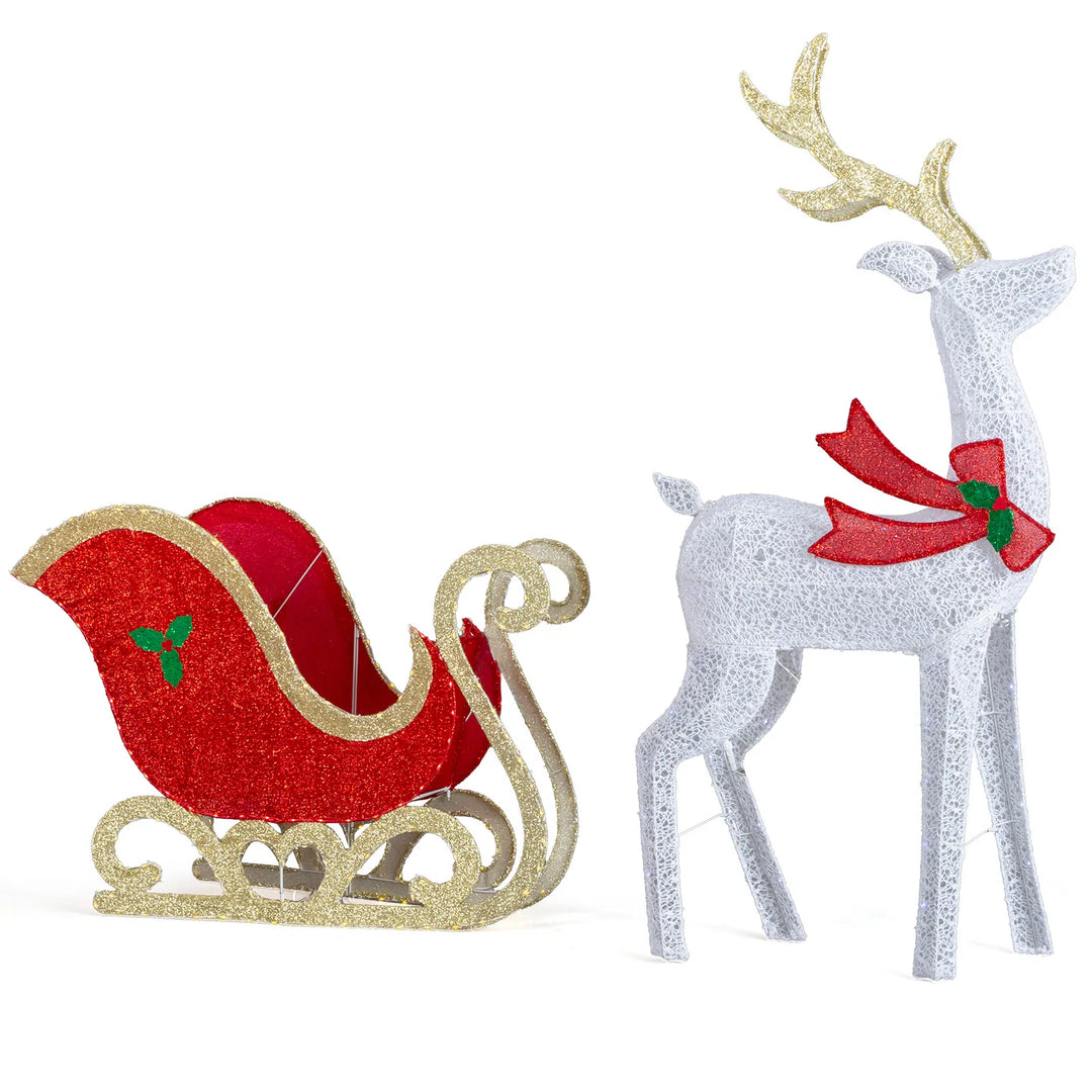 Lit reindeer and sleigh on front lawn