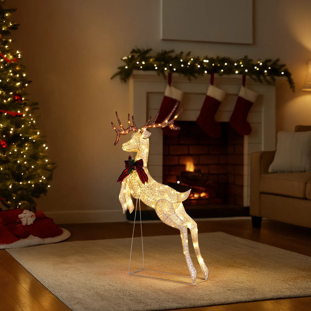 Light-up jumping reindeer with red bow