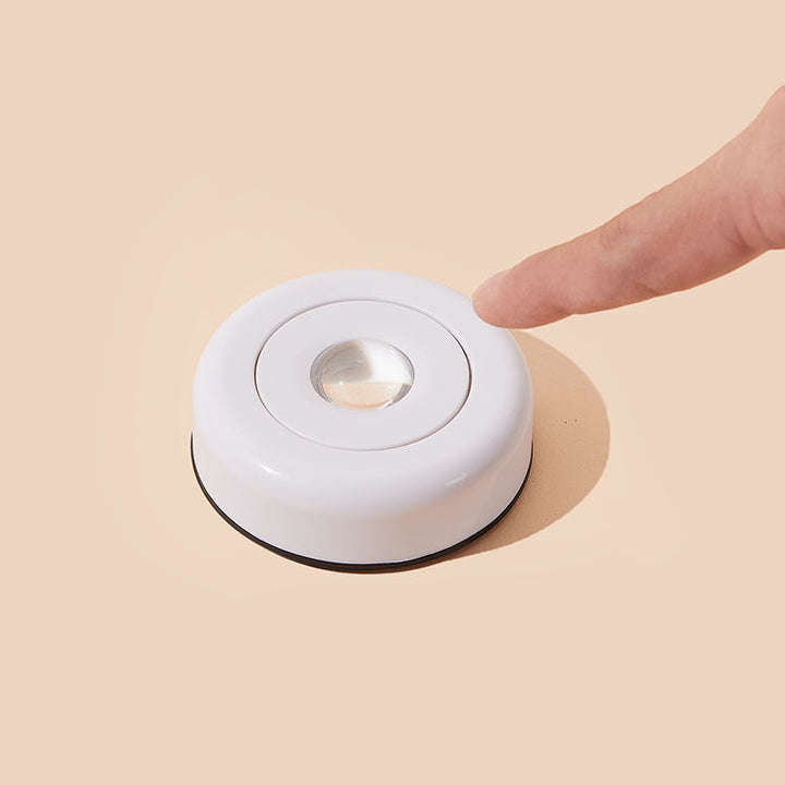 Round light casting sunset glow on wall