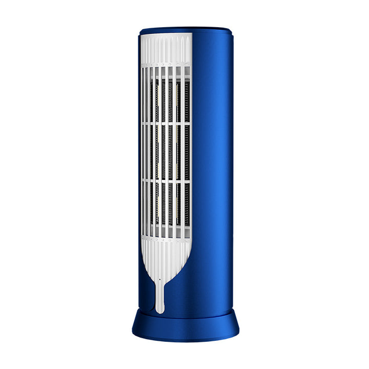 White compact tower fan heater on desk