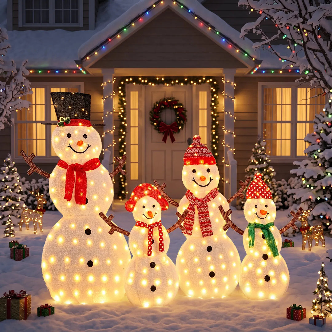 Family of four lit snowman figures