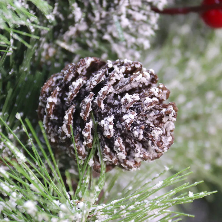Lit wreath with pine cones and red berries