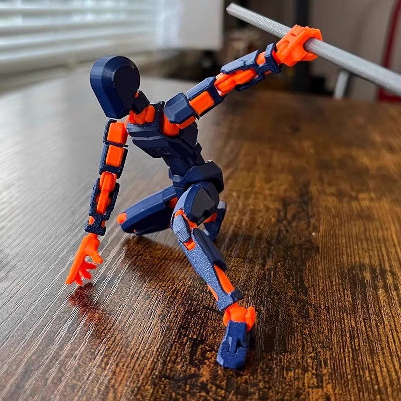 Poseable 3D printed robot figure on desk