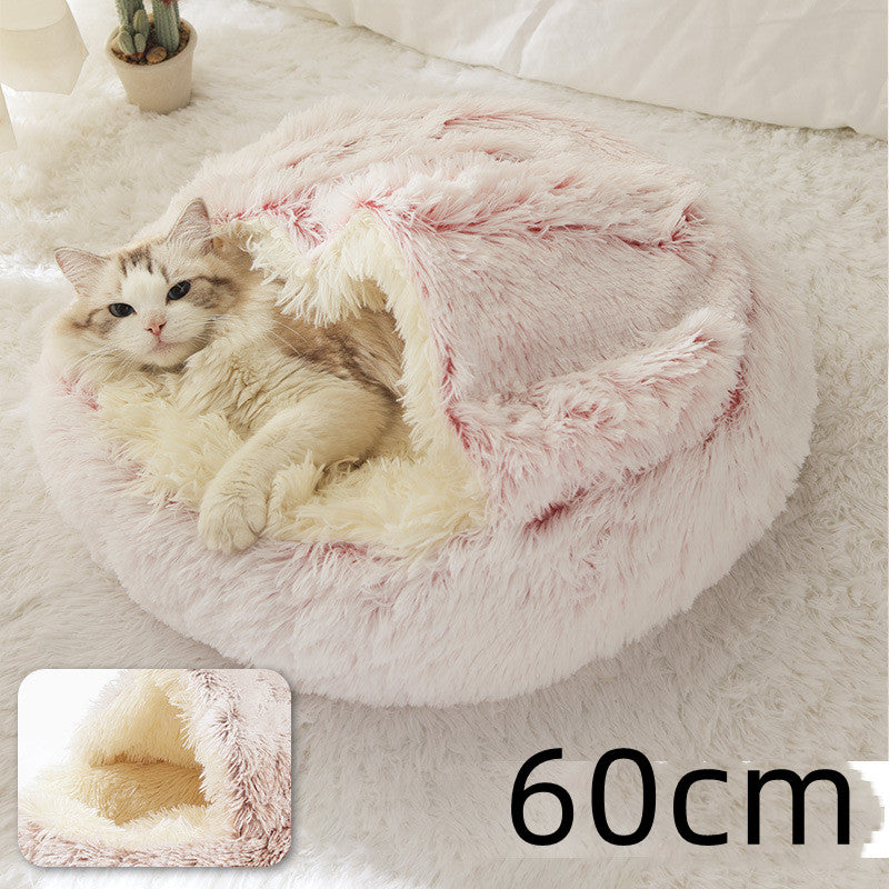 Cat curled in round plush hooded pet bed