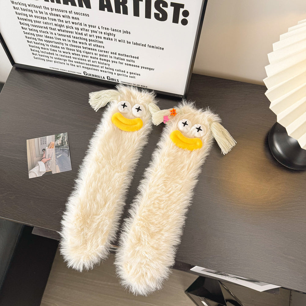 Fluffy socks with googly-eyed monster faces