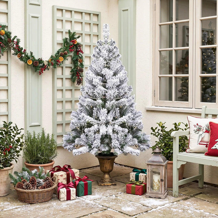 Small flocked tree in a decorative pot