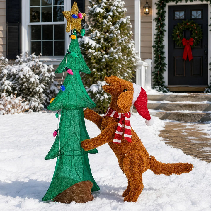 Plush dog climbing a lit Christmas tree