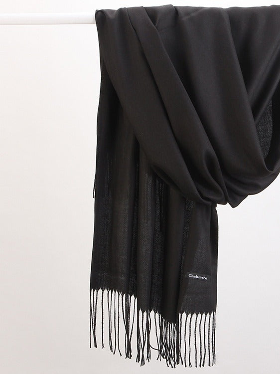 Woman in soft fringed scarf