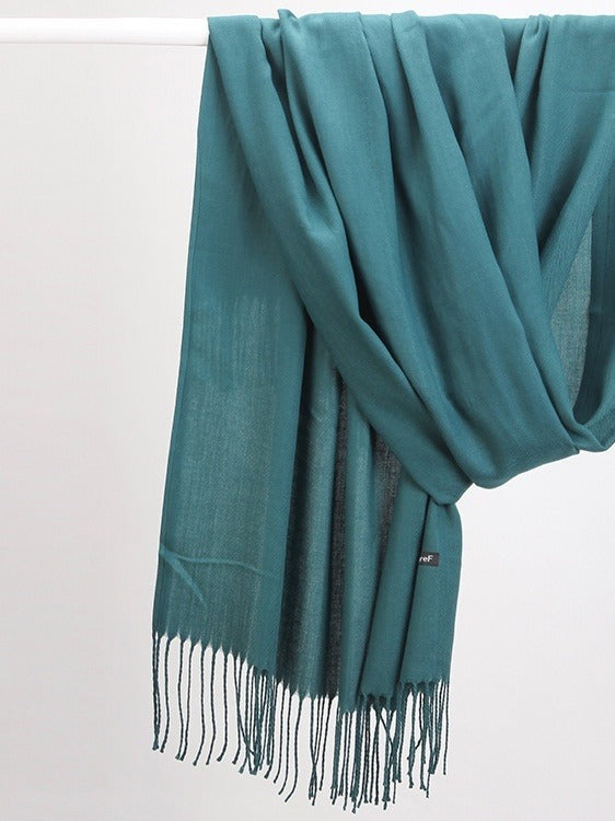 Woman in soft fringed scarf
