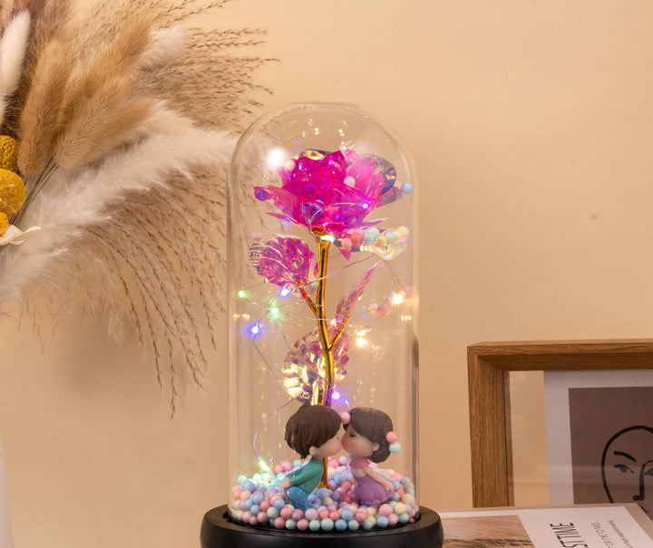 Red rose in glass dome with lights