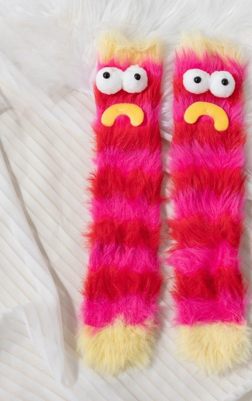 Fluffy pink monster socks with funny face