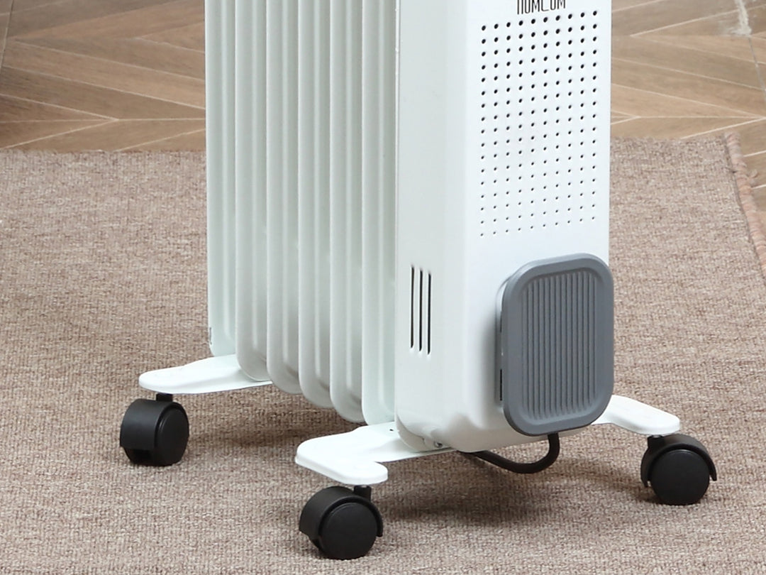 white 7 fin oil filled radiator on castor wheels