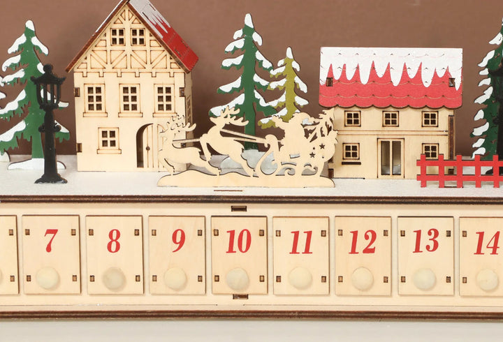 Long wooden lit advent calendar on mantel