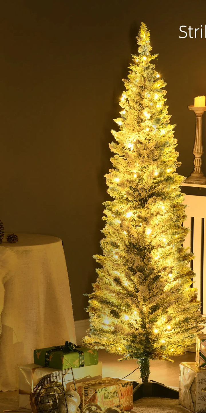 Snowy flocked pencil tree with warm lights